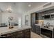 Spacious kitchen boasts an island, stainless appliances, and modern cabinetry for a chef's delight at 1444 E Boston St, Chandler, AZ 85225
