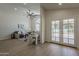 Open living room with high ceilings, a ceiling fan, and French doors leading to the outside at 1444 E Boston St, Chandler, AZ 85225