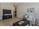 Cozy living room with modern decor, featuring a sleek entertainment center and comfortable seating at 1444 E Boston St, Chandler, AZ 85225
