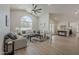 Spacious living room with vaulted ceilings, a large arched window, and modern furnishings at 1444 E Boston St, Chandler, AZ 85225