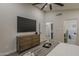 The main bedroom features a large TV, dresser and ensuite bathroom at 1444 E Boston St, Chandler, AZ 85225