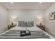 This bright and airy main bedroom features neutral tones and stylish bedside tables at 1444 E Boston St, Chandler, AZ 85225