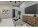 Main bedroom with TV, dresser, walk-in closet, and natural light creates a relaxing retreat at 1444 E Boston St, Chandler, AZ 85225