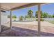 Covered patio with tiled flooring and views of the sparkling pool and desert landscaping at 1444 E Boston St, Chandler, AZ 85225