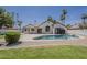 Inviting backyard pool, perfect for relaxation, complemented by desert landscaping and a spacious patio area at 1444 E Boston St, Chandler, AZ 85225