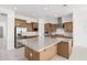 Well-appointed kitchen featuring a large island, stainless steel appliances, and ample cabinet space at 16981 W Cameron Dr, Surprise, AZ 85388