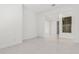 Spacious living room with tile floors, natural light, and seamless transitions at 16981 W Cameron Dr, Surprise, AZ 85388