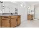 Bright bathroom with dual vanities, stylish fixtures, and plenty of counter space at 16981 W Cameron Dr, Surprise, AZ 85388