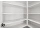 Spacious pantry features ample shelving for organized storage and easy access at 16981 W Cameron Dr, Surprise, AZ 85388