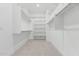 Spacious walk-in closet with ample hanging space and shelving for optimal organization at 16981 W Cameron Dr, Surprise, AZ 85388
