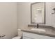 Bathroom featuring a modern vanity and a mirror at 17304 W Royal Palm Rd, Waddell, AZ 85355