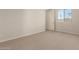 Relaxing bedroom with neutral carpet and white trim offers a comfortable private space at 17304 W Royal Palm Rd, Waddell, AZ 85355