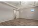Bedroom with a sliding barn door leading to the bathroom at 17304 W Royal Palm Rd, Waddell, AZ 85355