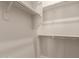 Walk-in closet with white shelving and rails is a great feature for storage at 17304 W Royal Palm Rd, Waddell, AZ 85355