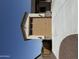 Attached two car garage with stone facade and beige door, showcasing convenient home access at 17304 W Royal Palm Rd, Waddell, AZ 85355