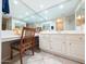 Bathroom vanity area with large mirror and ample counter space at 17404 N 99Th Ave # 126, Sun City, AZ 85373
