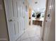 Bright bathroom featuring dual sinks, a vanity area, and a toilet in a separate alcove at 17404 N 99Th Ave # 126, Sun City, AZ 85373