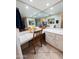 Vanity area with plenty of bright lights, mirrors, and storage at 17404 N 99Th Ave # 126, Sun City, AZ 85373