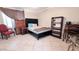 Cozy bedroom featuring a comfortable bed and a dresser at 17404 N 99Th Ave # 126, Sun City, AZ 85373