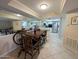 Open dining area provides views to the kitchen and living spaces in this home at 17404 N 99Th Ave # 126, Sun City, AZ 85373