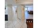 Bright hallway with tiled floors, showcasing the layout and flow of the home at 17404 N 99Th Ave # 126, Sun City, AZ 85373