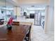 Bright kitchen with stainless steel appliances and white cabinetry with dining area adjacent at 17404 N 99Th Ave # 126, Sun City, AZ 85373