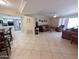 Open concept, living area with tile flooring, leads to the kitchen and bedrooms at 17404 N 99Th Ave # 126, Sun City, AZ 85373