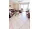 Cozy living room featuring comfortable leather seating and access to an outdoor patio at 17404 N 99Th Ave # 126, Sun City, AZ 85373