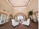 Inviting lobby area with ample seating, a high vaulted ceiling and stylish decor at 17404 N 99Th Ave # 126, Sun City, AZ 85373
