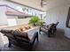 Relaxing covered patio with comfortable seating and views of the surrounding lush landscaping at 17404 N 99Th Ave # 126, Sun City, AZ 85373