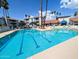 Inviting community pool has lane dividers, clear water, and a community recreation center at 17404 N 99Th Ave # 126, Sun City, AZ 85373
