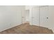 Empty bedroom features carpet, closet with sliding doors, and natural light at 17649 W Buchanan St, Goodyear, AZ 85338