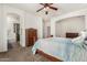 Spacious bedroom featuring carpet, ample natural light, and an ensuite bathroom at 17649 W Buchanan St, Goodyear, AZ 85338