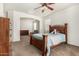 Bright bedroom with a ceiling fan, carpet, and multiple entry points adding design and function at 17649 W Buchanan St, Goodyear, AZ 85338