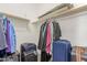 Walk-in closet with clothing rack, shelving, and extra luggage storage at 17649 W Buchanan St, Goodyear, AZ 85338