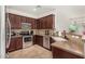 Well-equipped kitchen with stainless steel appliances, stylish cabinetry, and easy access to the living area at 17649 W Buchanan St, Goodyear, AZ 85338