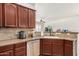 Kitchen with sleek stainless steel appliances, solid surface countertops, and ample storage space at 17649 W Buchanan St, Goodyear, AZ 85338
