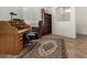 Cozy home office with a classic wooden desk, comfortable chair, and area rug, perfect for a productive workspace at 17649 W Buchanan St, Goodyear, AZ 85338