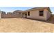 A new home's backyard with space for landscaping offers outdoor living and recreation at 18354 W Patrick Ln, Surprise, AZ 85387