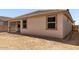 A covered patio offers outdoor relaxation space in the backyard of this new home at 18354 W Patrick Ln, Surprise, AZ 85387
