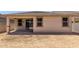 A new home's covered patio and backyard space awaiting landscaping and personalization at 18354 W Patrick Ln, Surprise, AZ 85387