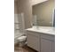Well-lit bathroom with a double sink vanity, bathtub and bright walls at 18354 W Patrick Ln, Surprise, AZ 85387