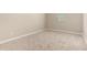 This neutral bedroom offers plush carpet and a window for natural light at 18354 W Patrick Ln, Surprise, AZ 85387