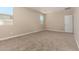 Neutral bedroom with carpeting, natural light and neutral paint at 18354 W Patrick Ln, Surprise, AZ 85387