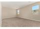 Neutral bedroom with carpeting, natural light and neutral paint at 18354 W Patrick Ln, Surprise, AZ 85387
