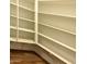 Custom white shelving units provide ample storage and organizational space at 18354 W Patrick Ln, Surprise, AZ 85387