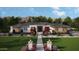 Inviting single-story home featuring manicured lawn, brick facade, and decorative pathway to the front door at 1951 E Long Rifle Rd, Phoenix, AZ 85086