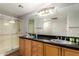 Double sink bathroom featuring granite countertops, and modern fixtures at 20660 N 40Th St # 2124, Phoenix, AZ 85050