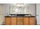 Bathroom featuring double sinks, granite countertop, and a large mirror at 20660 N 40Th St # 2124, Phoenix, AZ 85050