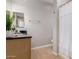 Bathroom featuring neutral walls, light wood cabinets, granite counters and a shower with a white curtain at 20660 N 40Th St # 2124, Phoenix, AZ 85050
